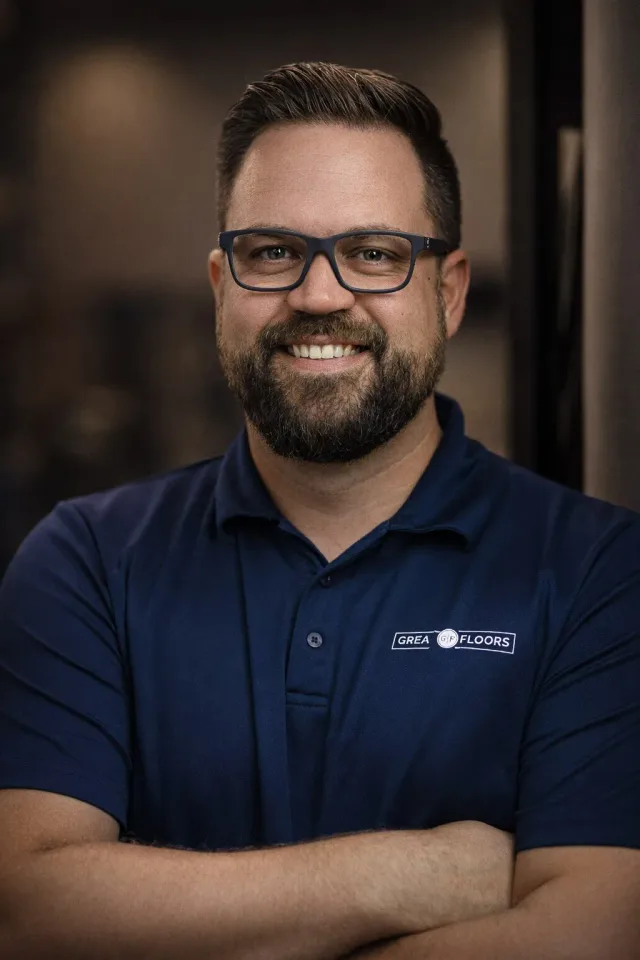 Employee headshot for Great Floors, showing a smiling man wearing glasses