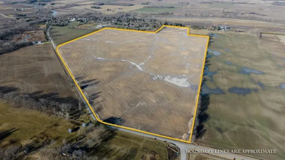Aerial drone photograph showing outlined boundary of large farmland property for sale in Southwestern Ontario captured for agricultural land marketing and real estate listings.
