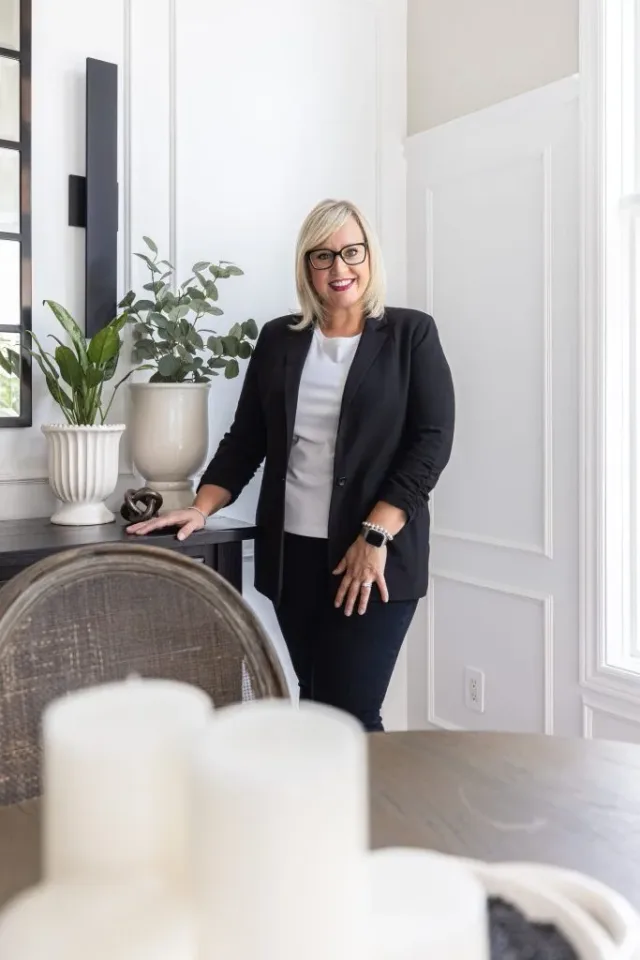 Professional portrait of a woman in a modern interior, captured by MPV | Mike Popovici Visuals in London, Ontario, showcasing natural light and lifestyle branding photography.