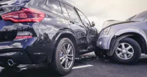 A car crash depicting two SUVs involved.