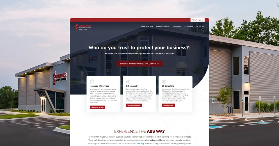 Screenshot of the Advanced Business Solutions B2B technology website homepage, displaying service options for Managed IT, Cybersecurity, and IT Consultancy, set against a modern office building background.