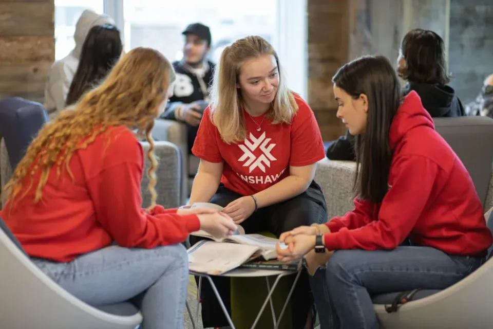 Students cooking together in the shared kitchen at Foundry First ,  lifestyle photography capturing community and modern student living in London Ontario by MPV | Mike Popovici Visuals.